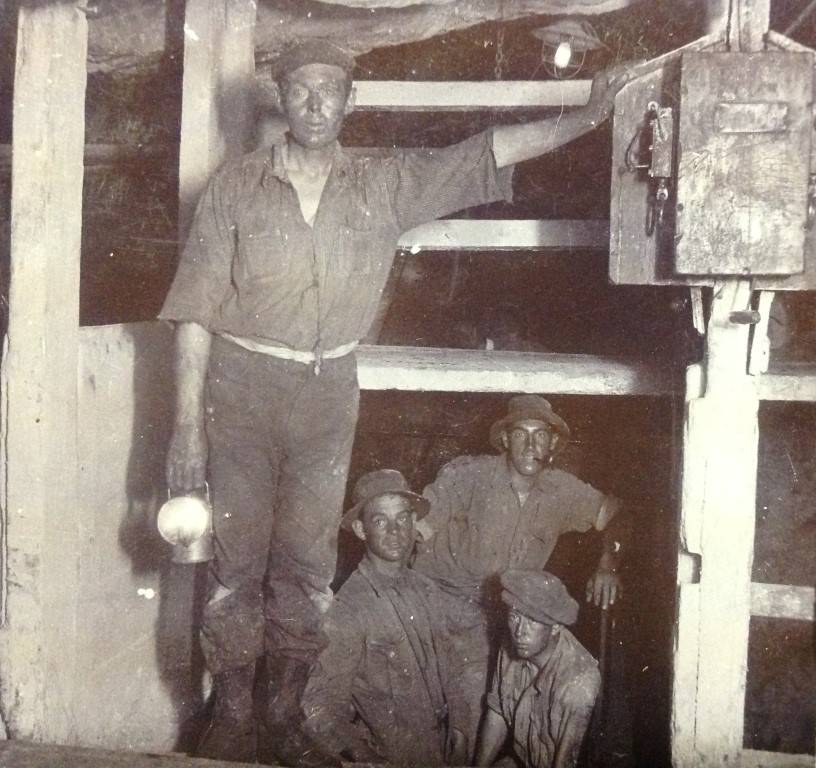 Miners in shift cage at the Crown Mines. Photographed by Raymond